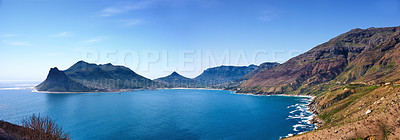 Buy stock photo Top landscape view of ocean surrounded by mountains in Hout Bay in Cape Town, South Africa. Popular tourist attraction of hills and calm blue water from above. Exploring nature and the wild