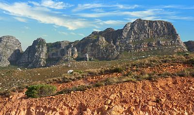 Buy stock photo Low angle view of a mountain peak in South Africa. Scenic landscape of a remote hiking location on Lions Head in Cape Town during a sunny day. Traveling and exploring nature through adventure