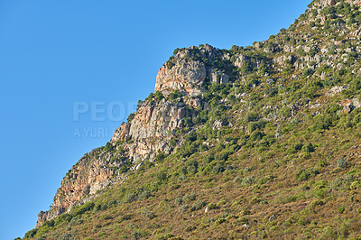 Buy stock photo Landscape view of mountains in Hout Bay in Cape Town, South Africa during summer holiday and vacation. Scenic hills, scenery of fresh green flora growing in remote area. Exploring nature and the wild