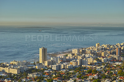 Buy stock photo Ocean, travel and city on hill with sky, buildings and natural horizon at coastal town location. Nature, cityscape and urban development on island with water, skyline or holiday destination in Spain