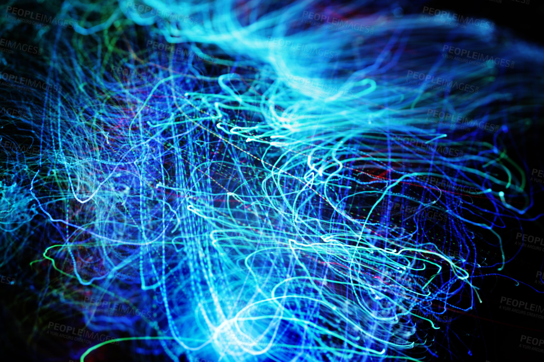 Buy stock photo Long exposure of fiber optical light cables in LED neon blue glow. Optics with spiral motion effects for fast data, network and internet usage. Digital abstract of electric lines on dark background