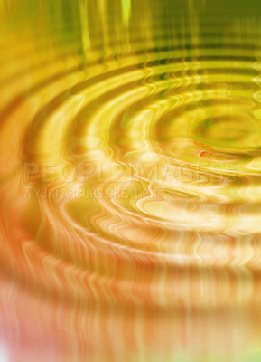 Buy stock photo Closeup of a water ripple pattern after a drop splashed into a puddle. Creative copyspace and background detail effect of rain on a lake. Tranquil orange and yellow circle reflections on a pond  