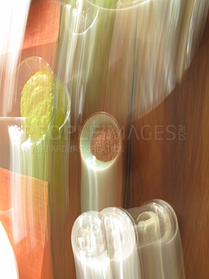 Buy stock photo Motion blur, blurred, defocused view of food and spices on a wooden table in a restaurant, cafe or home. Above and aerial view of lunch or dinner served with salt or pepper flavorings. Eating healthy