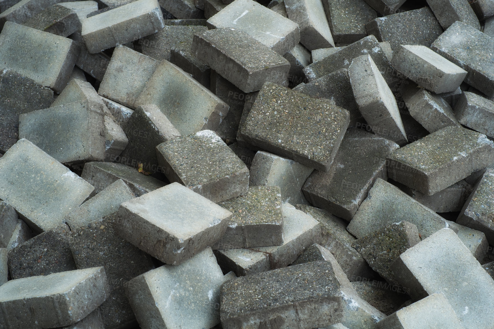 Buy stock photo Pile of grey concrete bricks background Damp building bricks lying on construction site. Pile of grey granite pavement bricks ready to be laid on sidewalk. Construction and building material industry