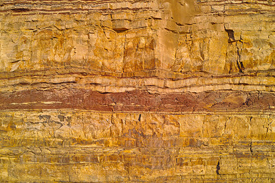 Buy stock photo Closeup of layered stone and detail. Remote and textured background layers of earth, sedimentary minerals, stones with copyspace. Mining underground geological strata rock or sand for geology studies