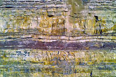 Buy stock photo Background of textured layers of earth, sedimentary minerals and stones. Mining underground geological strata rock or sand for geology studies. Closeup of remote layered stone detail with copyspace