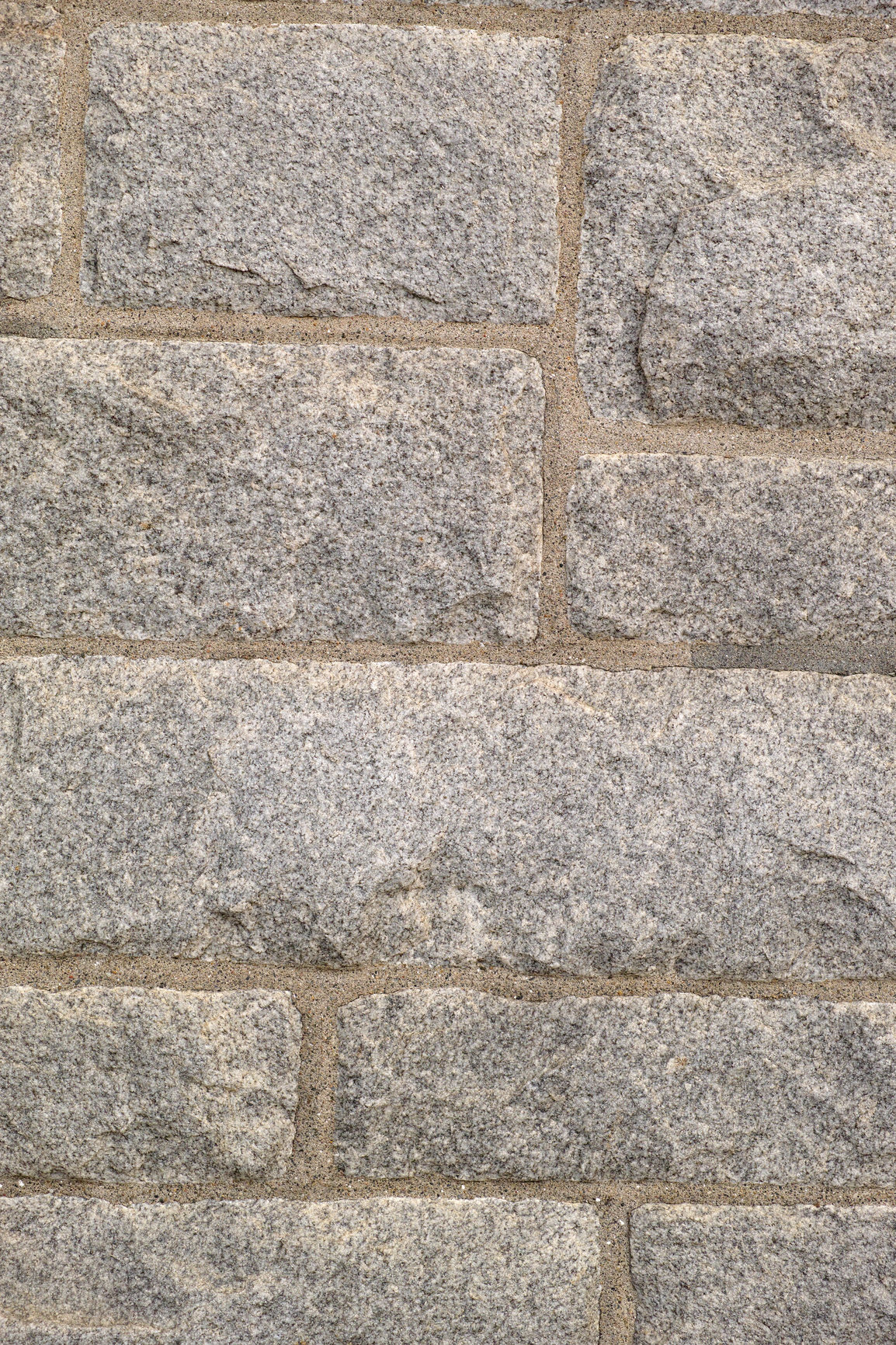 Buy stock photo Closeup of granite stone wall outside in a city during the day. Macro view of detail and texture on historic, strong and sturdy exterior downtown. Walled pattern on a castle or old, ancient building