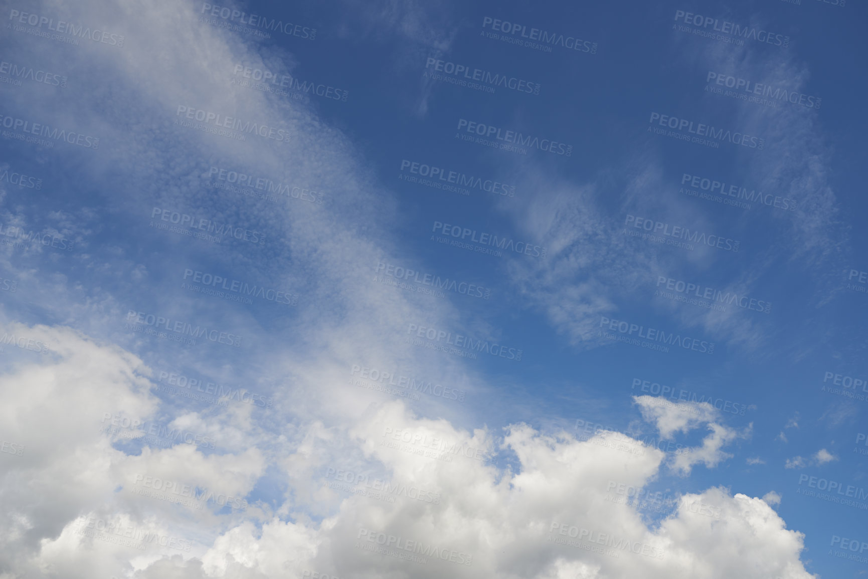 Buy stock photo Below view of clouds with copy space in a blue sky during summer. Low angle of a nature background, copyspace, cumulus clouds and sunshine. Enjoying a beautiful afternoon and day outside in fresh air