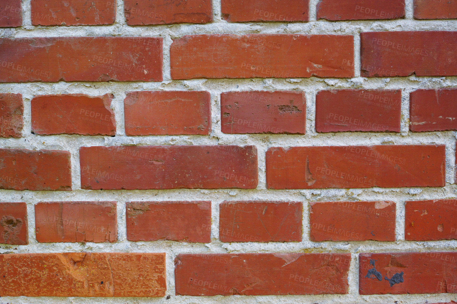 Buy stock photo Closeup of a brick wall with cement and rough texture on a home or house. Details of modern architecture on of a residence or building as a background. Solid red brickwork on a wall