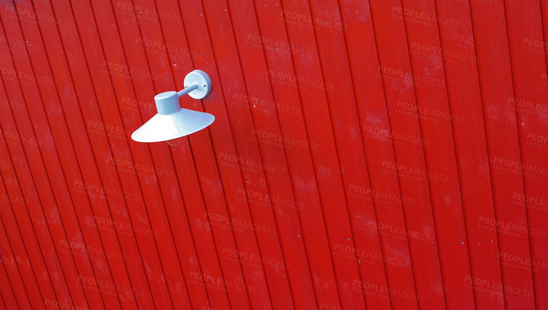 Buy stock photo White lamp on a bright red wall or background with copy space. Abstract architecture and electrical lighting design mounted with bulb to provide illumination indoors or outdoors in the dark
