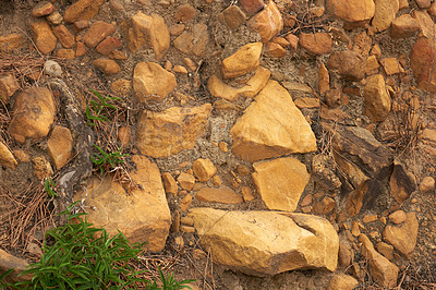 Buy stock photo Above view of rocky landscape, boulders, stones along a remote hiking and trekking trail in nature. Scenery of rough terrain during outdoor hike. Exploring mother nature during recreation adventure