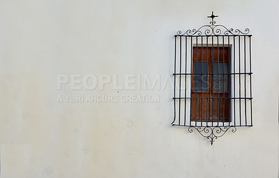 Buy stock photo View of rectangular window on a white wall behind a cast iron railing of antique design. Closeup of a building with an old wooden window with a metal frame on a historic church or house and background