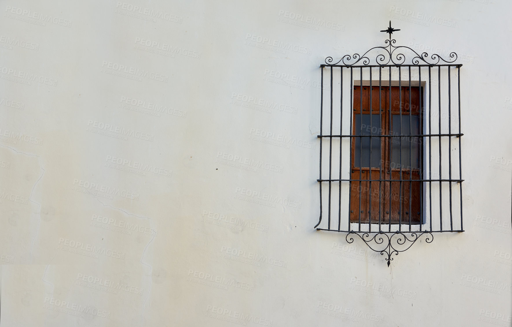 Buy stock photo View of rectangular window on a white wall behind a cast iron railing of antique design. Closeup of a building with an old wooden window with a metal frame on a historic church or house and background