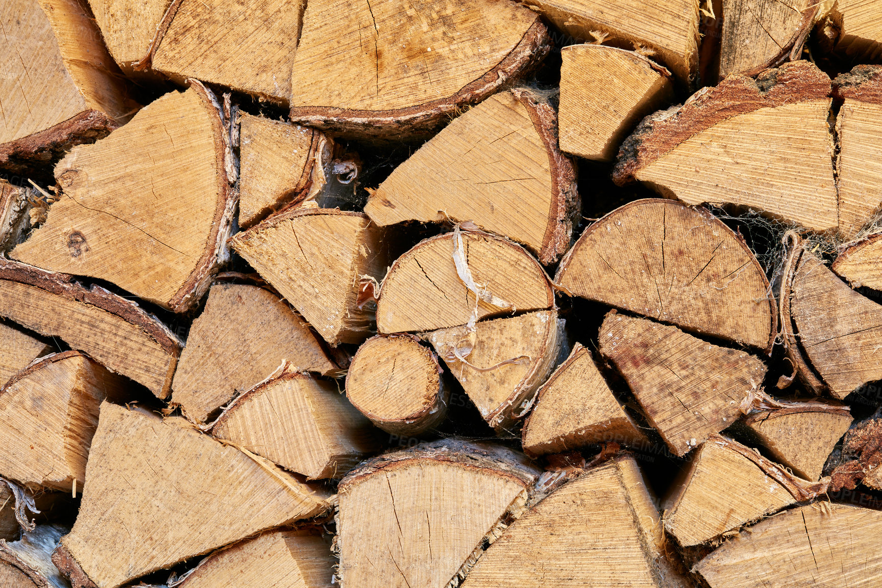 Buy stock photo Above view of chopped firewood, logs stacked together in storage pile. Closeup of wooden background and texture. Collecting dry rustic wood as a source of energy. Lumber split hardwood with copyspace