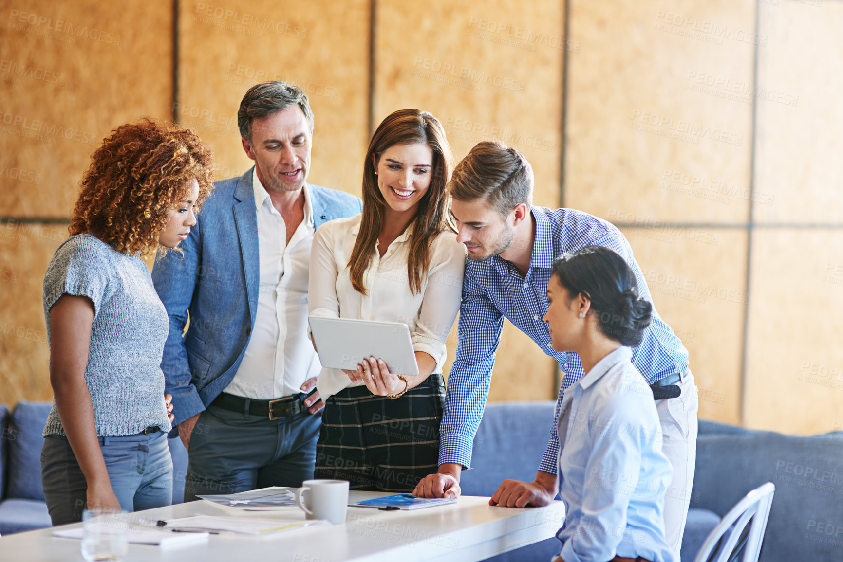 Buy stock photo Shot of a group of colleagues working together in an office