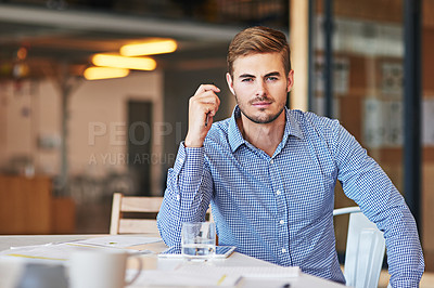 Buy stock photo Office, corporate and portrait of a young businessman working on a company project or report. Success, leadership and professional male employee or leader planning a strategy in the modern workplace.