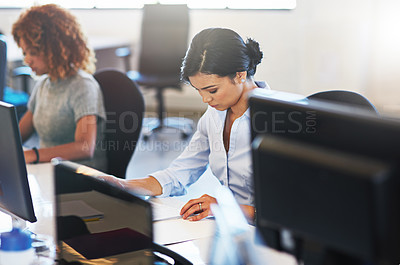 Buy stock photo Shot of young businesswomen working in the office