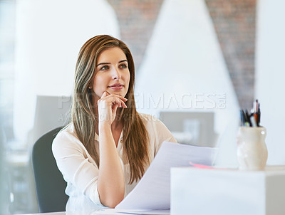 Buy stock photo Shot of a young businesswoman working in the office