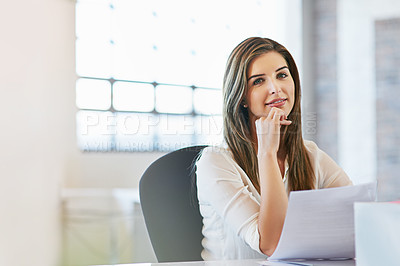 Buy stock photo Shot of a young businesswoman working in the office