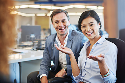 Buy stock photo Shot of a coworkers talking together in an office