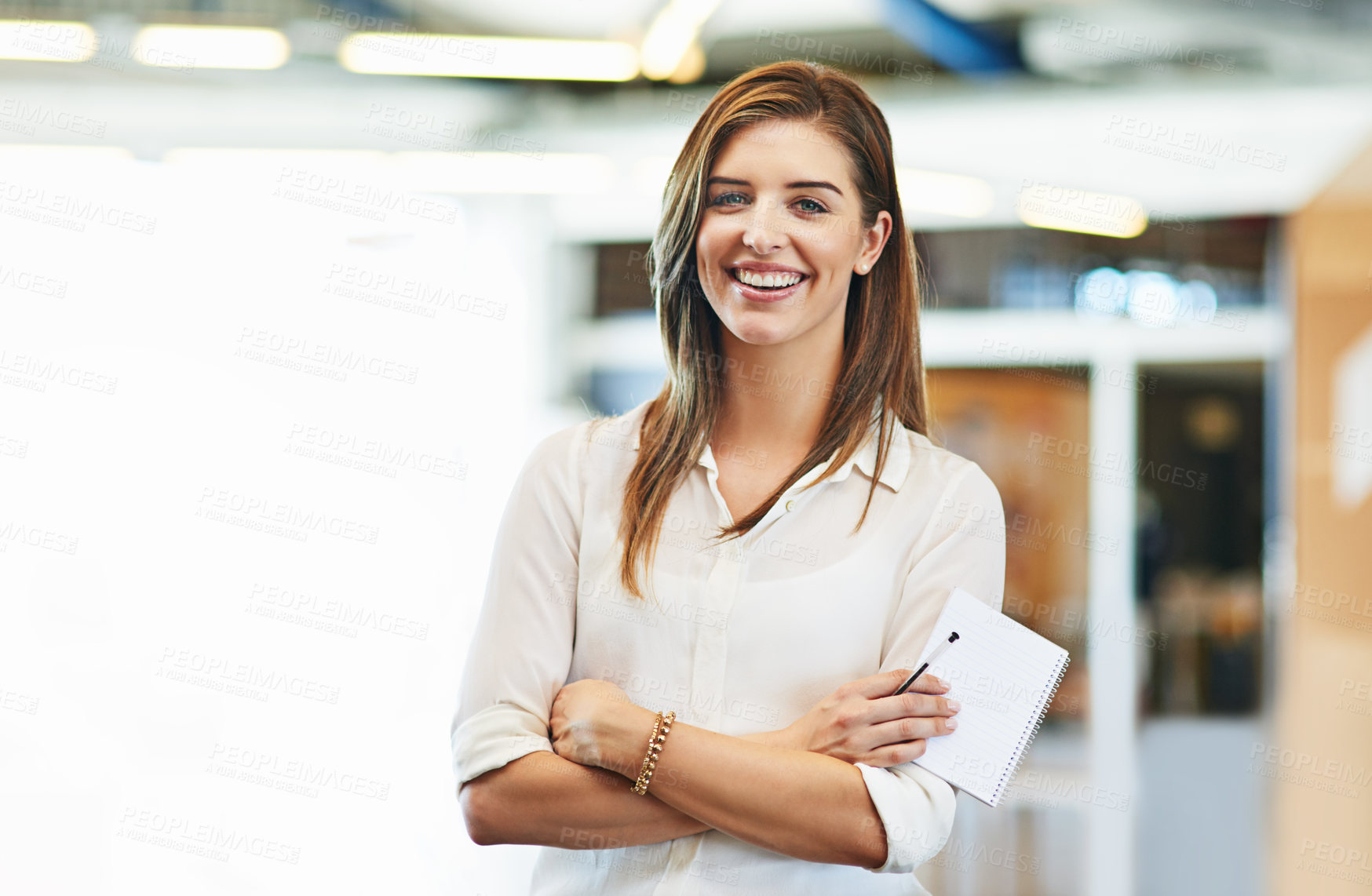 Buy stock photo Portrait of a smiling young woman standing in an office