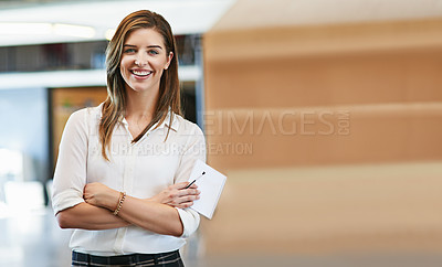 Buy stock photo Portrait of a smiling young woman standing in an office