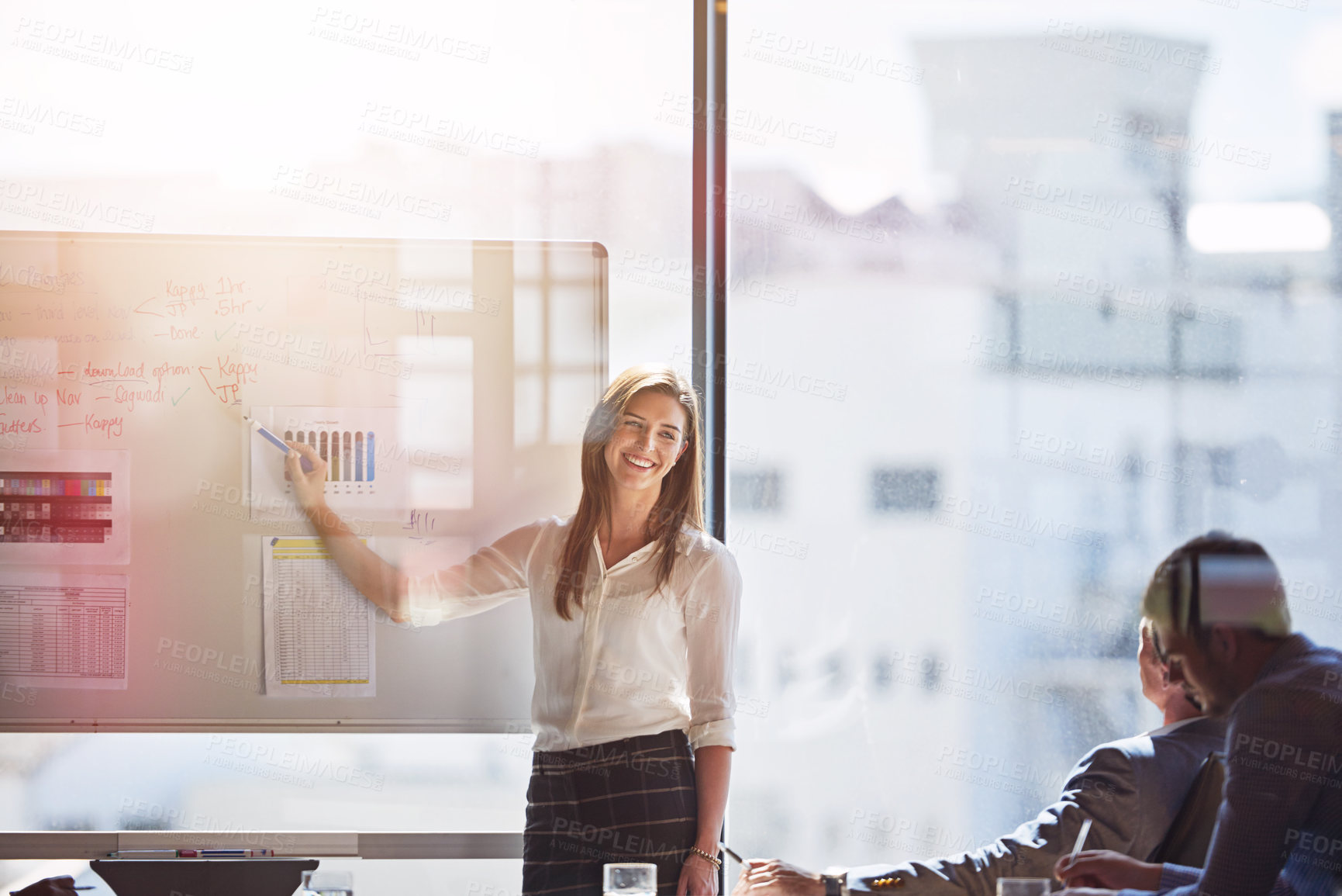 Buy stock photo Shot of businesspeople brainstorming in a boardroom