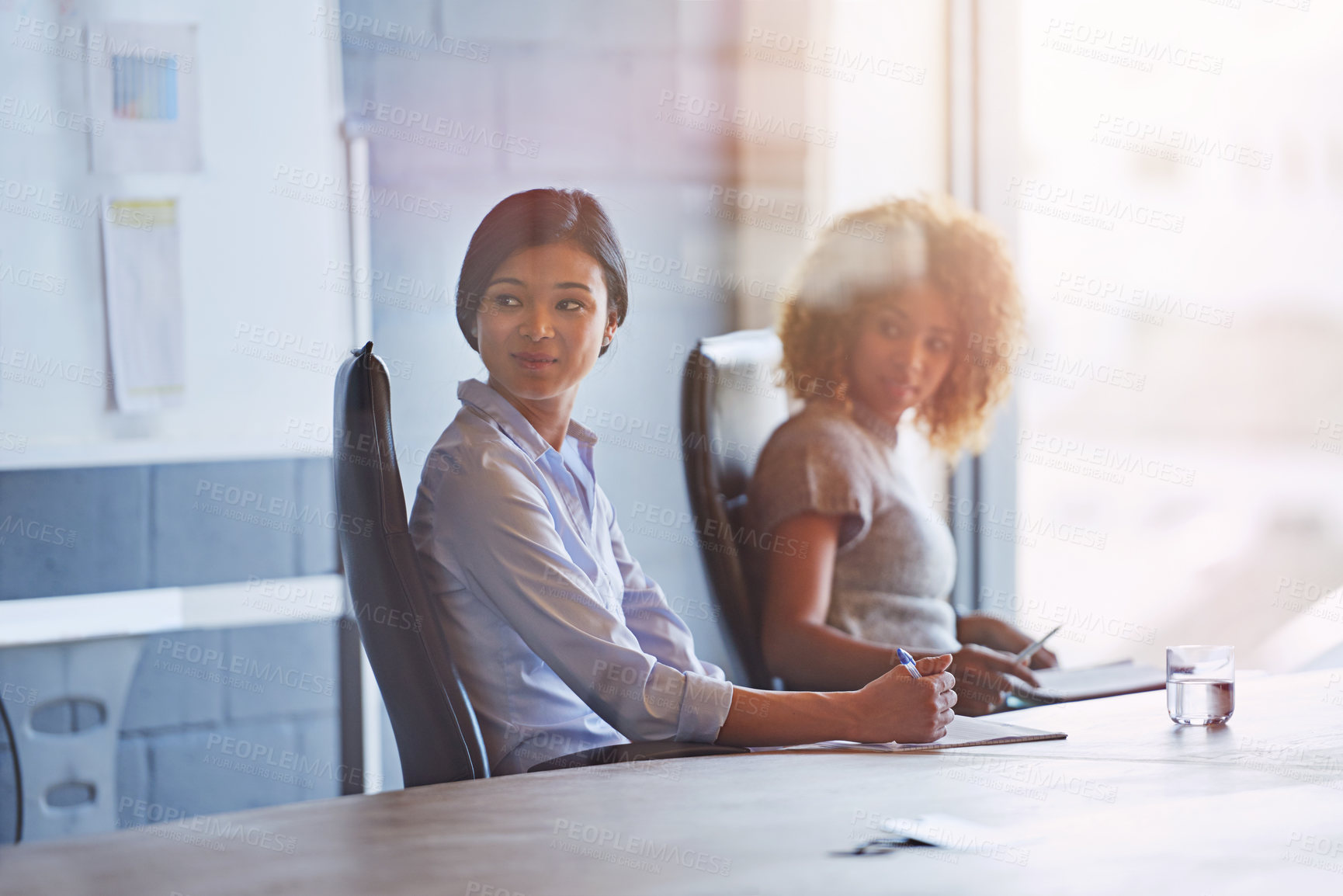 Buy stock photo Business people, women and office at desk for meeting, innovation or planning for marketing strategy. Black woman, focus and business meeting for goal in modern office, teamwork or company vision