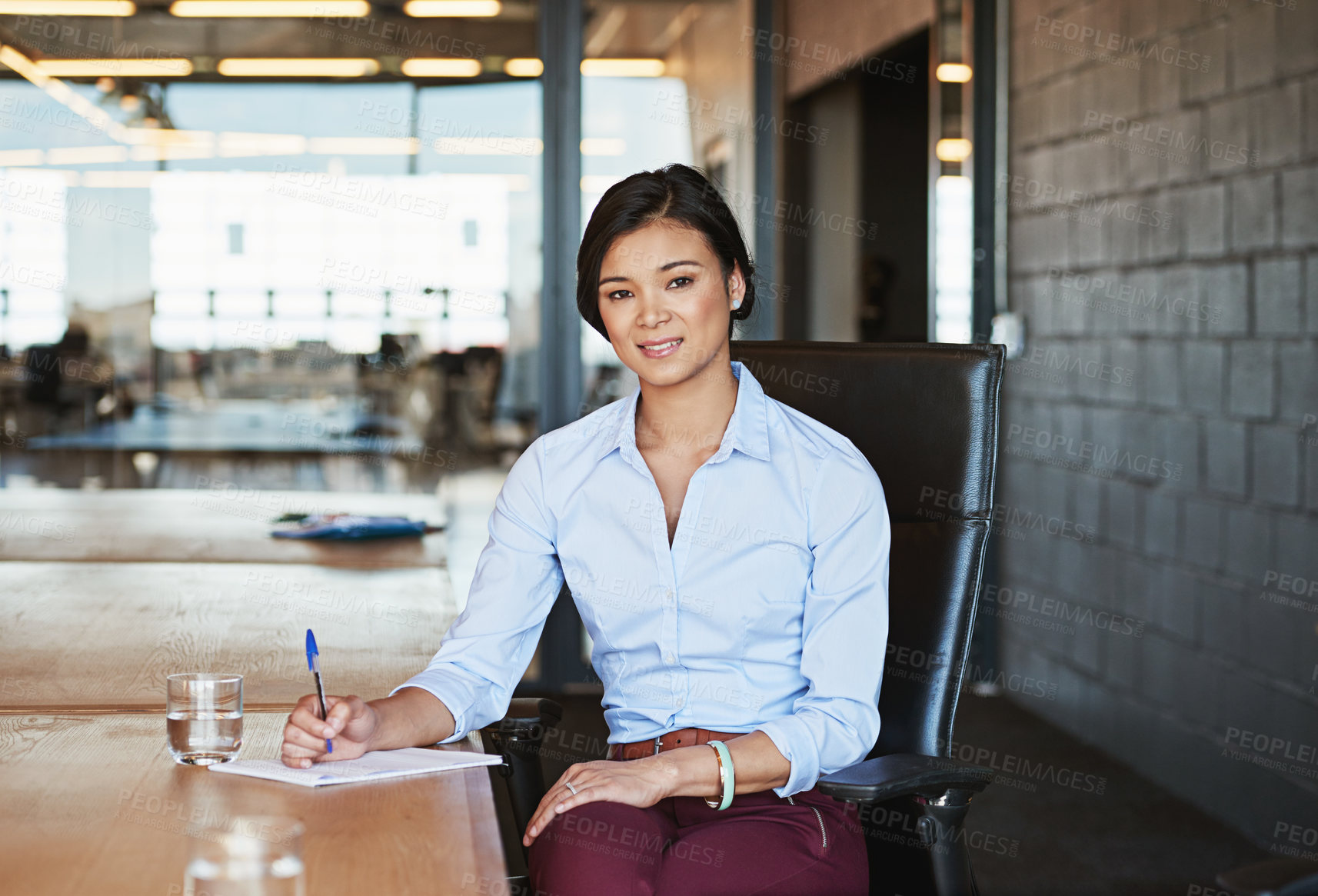 Buy stock photo Business woman, portrait smile and writing for planning, strategy or signing contract of employment at office desk. Young female employee working on paperwork for corporate plan or idea at workplace