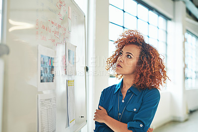 Buy stock photo Black woman, thinking and planning idea on whiteboard in office for creative design, strategy management or planning. African female designer, goals vision and presentation review or analytics data