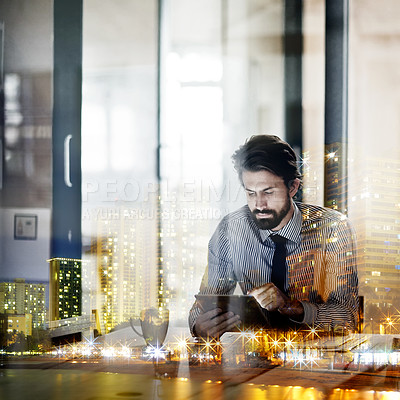 Buy stock photo Multiple exposure shot of a young businessman working in an office superimposed on a city at night