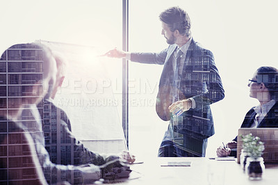 Buy stock photo Multiple exposure shot of colleagues in a presentation superimposed over a city at night