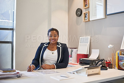 Buy stock photo Portrait of a businesswoman sitting at her desk in an office