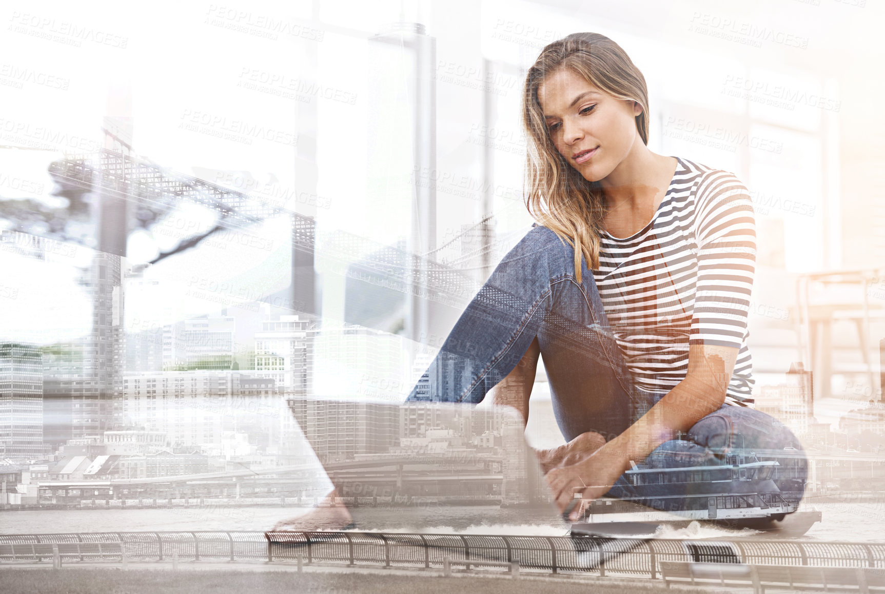 Buy stock photo Multiple exposure shot of a young woman using a laptop superimposed over a city background