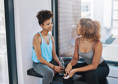 Buy stock photo Cropped shot of two young women talking after yoga class