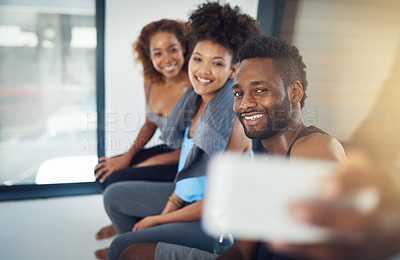 Buy stock photo Cropped shot of three young people taking a selfie after yoga class