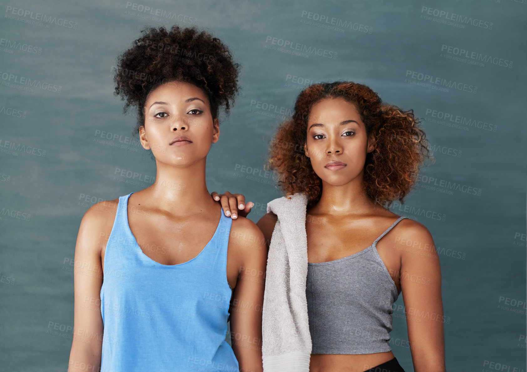 Buy stock photo Studio portrait of two young women after yoga class against a grey background