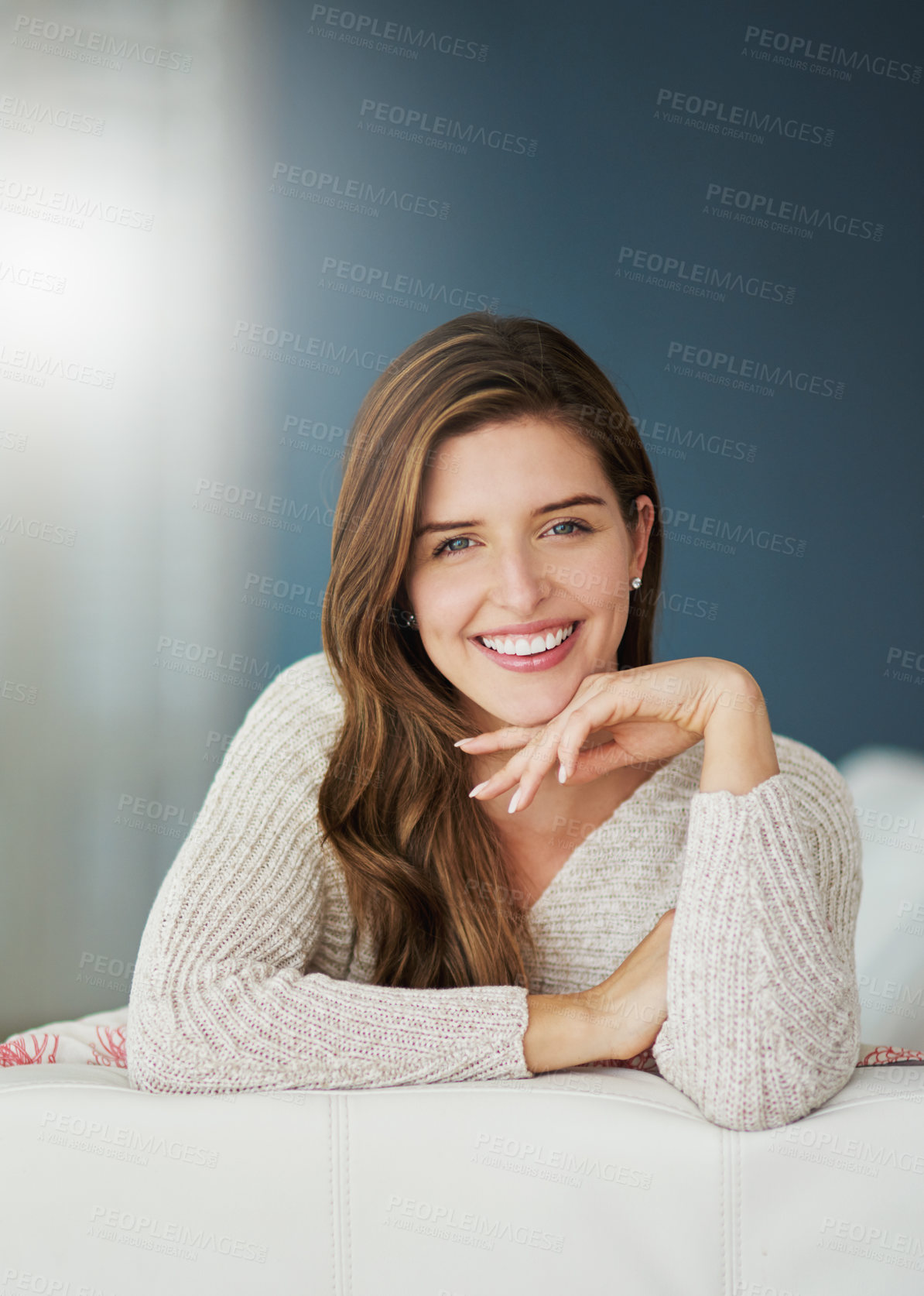 Buy stock photo Smile, portrait and woman relax on sofa in home living room on holiday. Face, happy and young female person from Canada on couch in lounge, apartment or house to enjoy mockup space and lens flare.