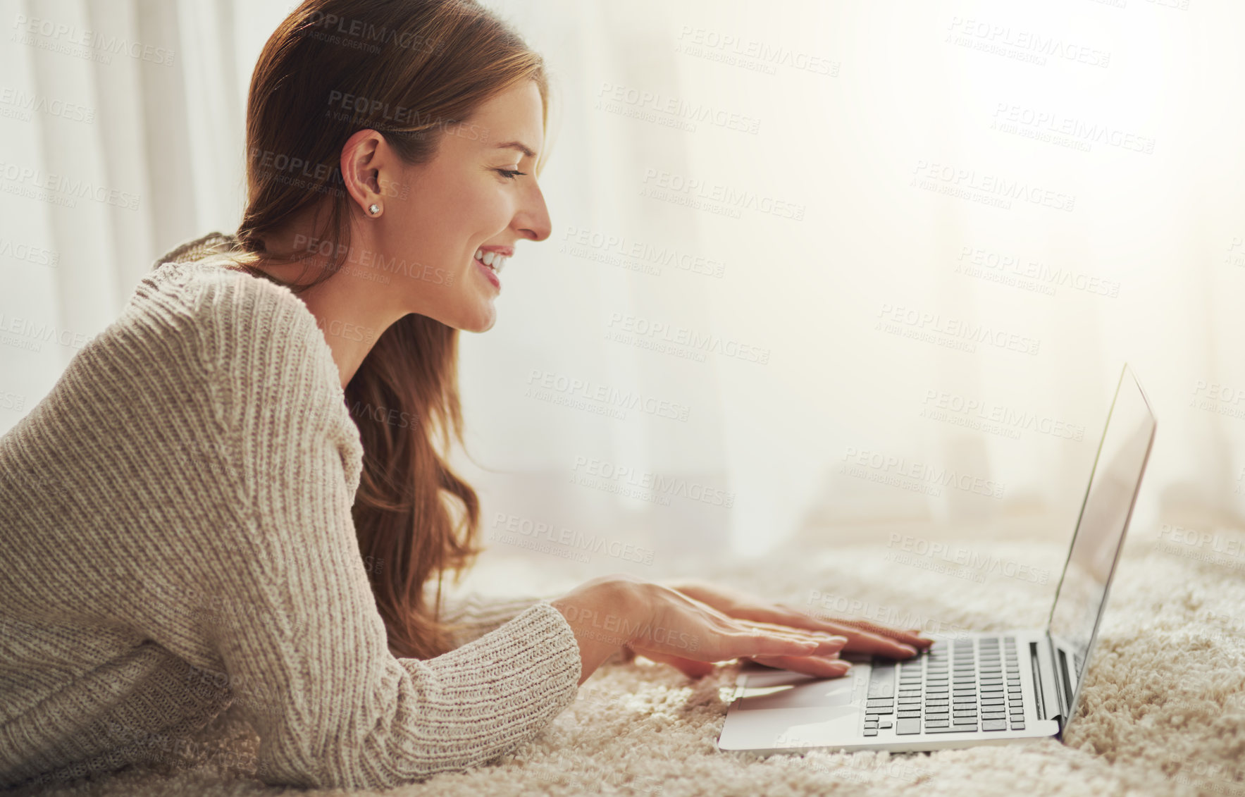 Buy stock photo Shot of a young blonde woman relaxing at home