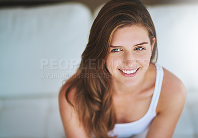 Buy stock photo Shot of a young woman relaxing at home