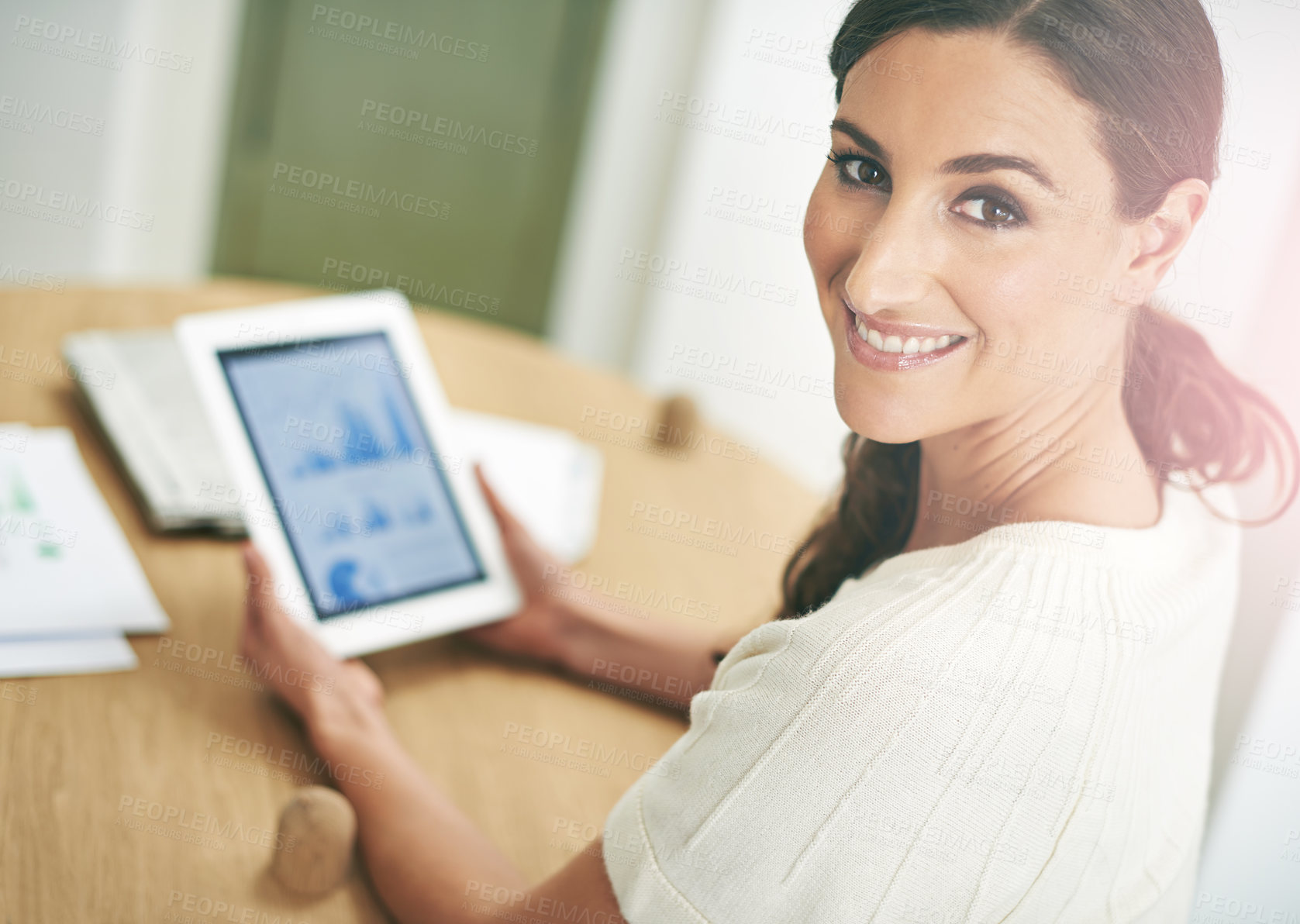 Buy stock photo Portrait of a young businesswoman using a digital tablet