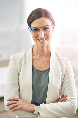 Buy stock photo Portrait of a young businesswoman standing in an office wearing a pair of smart glasses