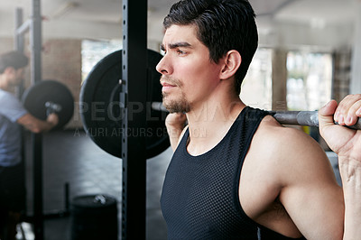 Buy stock photo Shot of a young athlete working out in the gym