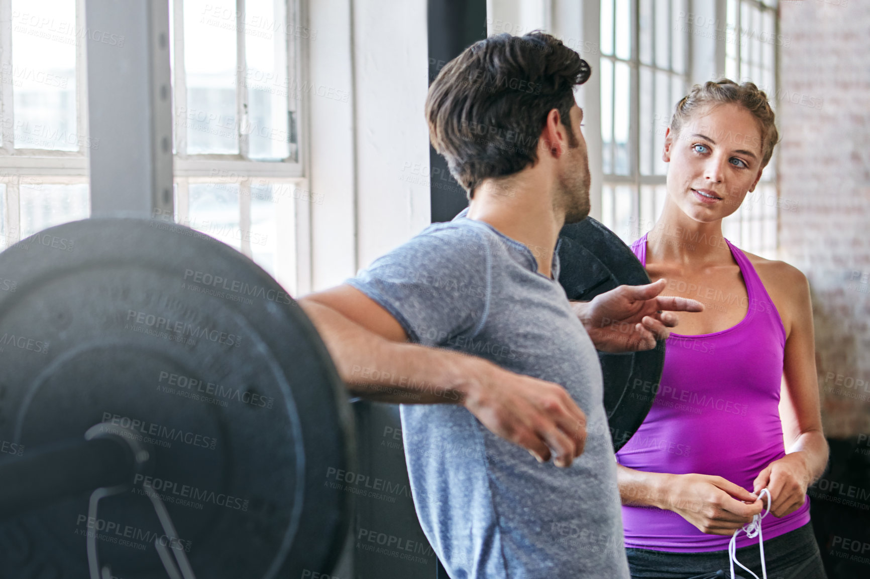 Buy stock photo Shot of two people chatting at the gym