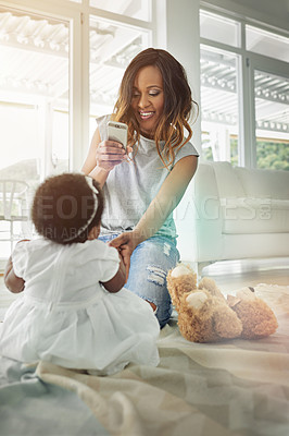 Buy stock photo Happy woman, baby and cellphone for childhood development, motor skills or bonding as family in playroom. Mother, daughter and home with pride, love and support or growth in photography for memory