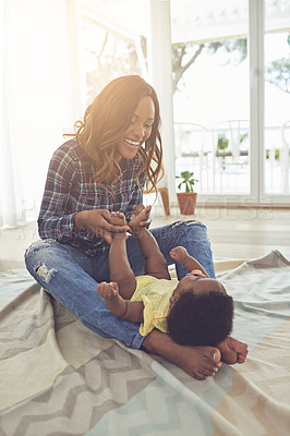 Buy stock photo Full length shot of a young mother and her little baby girl at home