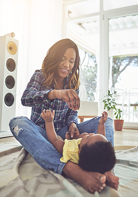 Buy stock photo Full length shot of a young mother and her little baby girl at home