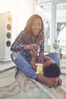 Buy stock photo Happy, playing and black woman with baby in home for bonding, connection and family time. Love, sweet and African mom having fun with cute infant on floor in living room for development in house.