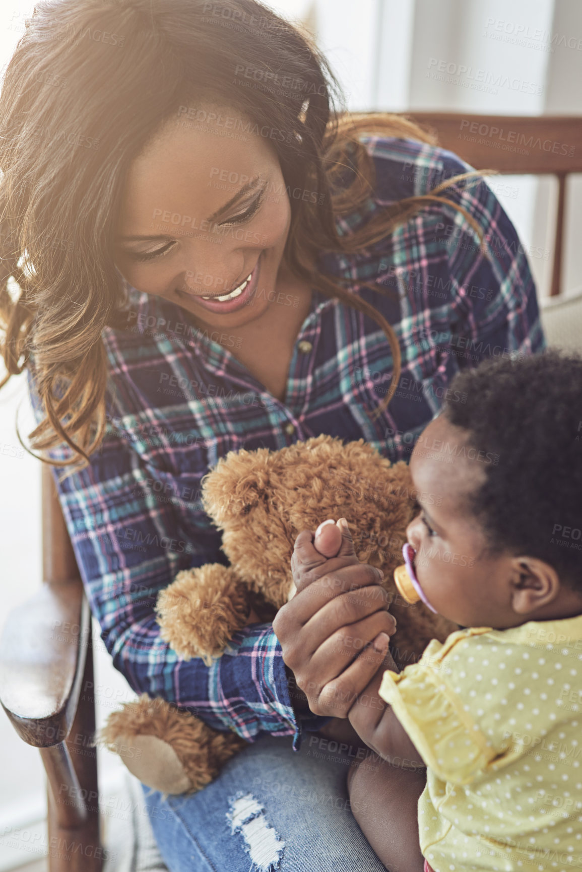 Buy stock photo Black family, woman and playing with baby in home, teddy bear and love for growth or development. Stuffed animal, games and support daughter with cognitive learning, motherhood and trust mother