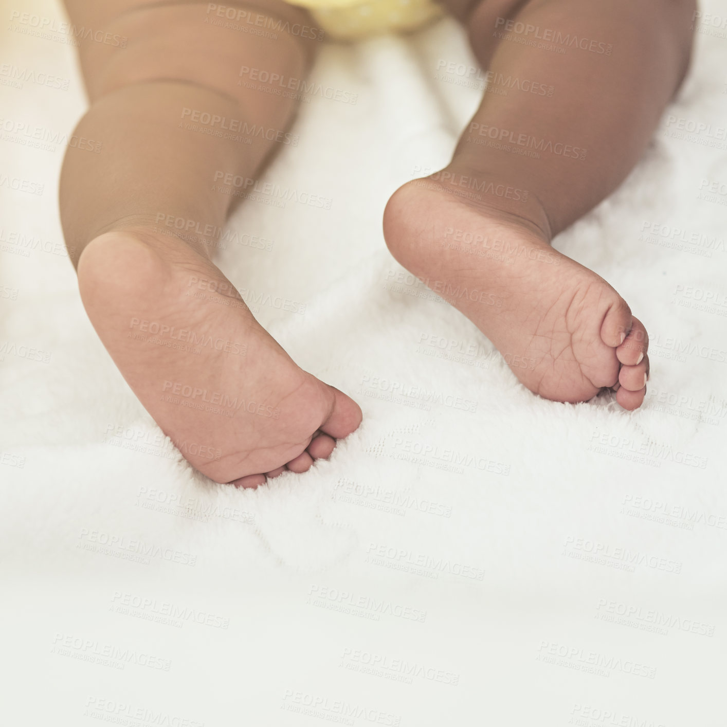 Buy stock photo Cropped shot of a baby girl asleep on a bed at home